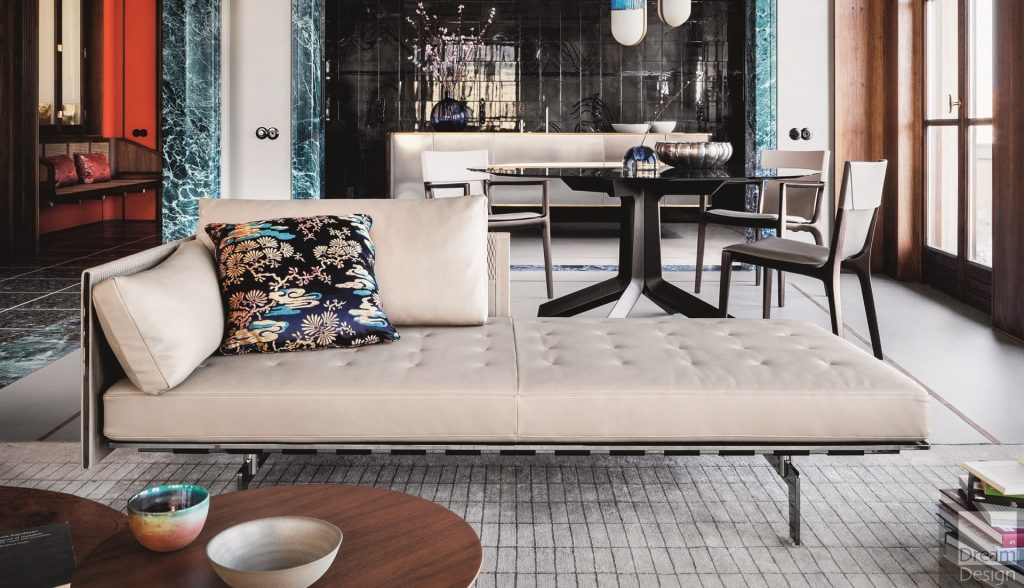 sala com uma decoração oderna, uma poltrona estilo Chaise longue na cor branca 