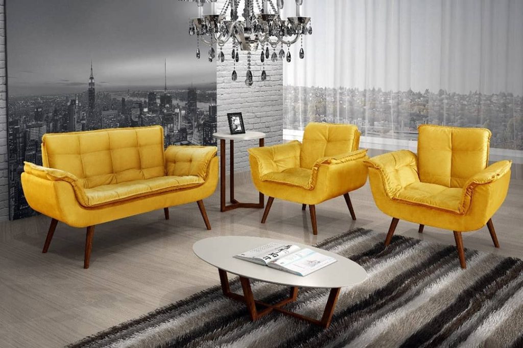 sala com 3 poltronas amarelas e decoração cinza 