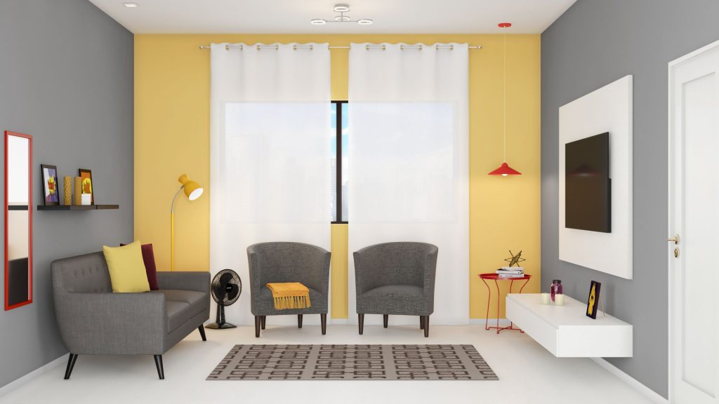 sala ampla, com poltronas na cor cinza e decoração em amarelo, branco e cinza